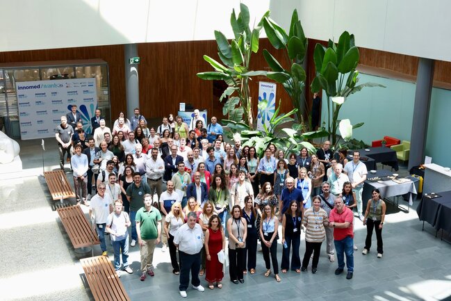 Group photo of the innomed community at the hall of  Josep Carreras Institute